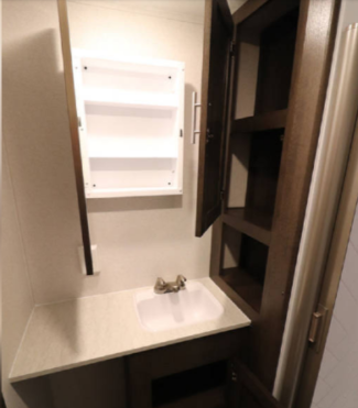 Yet more storage in the bathroom!  A regular house toilet has also been installed for your comfort.  All bed and bath linens are included in your rental fee, in addition to a washer/dryer combo located in the bedroom area.